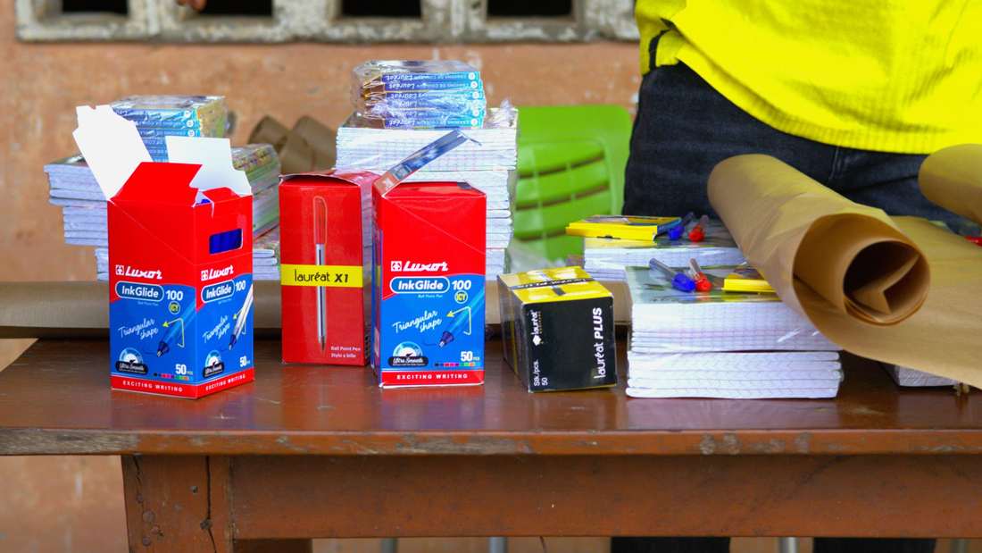 Notebooks, pens and coloured pencils, ready for the handover